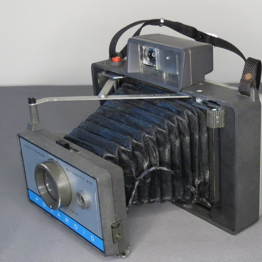 Vintage Polaroid Automatic 210 Land Camera with Case, Strap, Flash, Film Contain